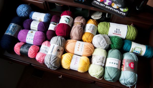 Desk full of popular acrylic yarns